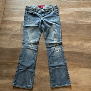 Vintage guess woman’s jeans size 28, flare boot leg and braided belt.